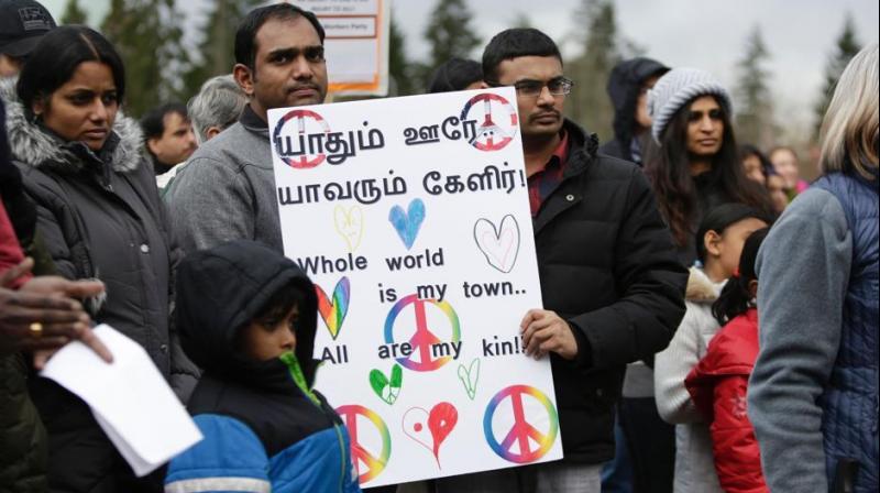 Members of the South Asian community and others attend a peace vigil for Srinivas Kuchibhotla, the 32-year-old Indian engineer killed at a bar Olathe, Kansas, in Bellevue, Washington on March 5, 2017.(Photo: AFP)