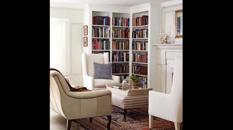 An L-shaped bookshelf in the corner of your reading space can turn it into a modest home library.