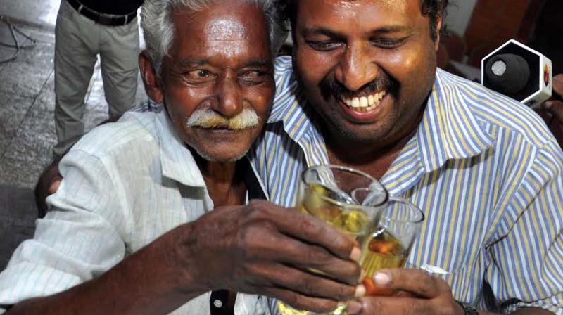 Tipplers in a jubilant mood after three and four star bars in the state resumed business on Sunday. A view from Kathrikadavu in Kochi.  (Photo: SUNOJ NINAN MATHEW)