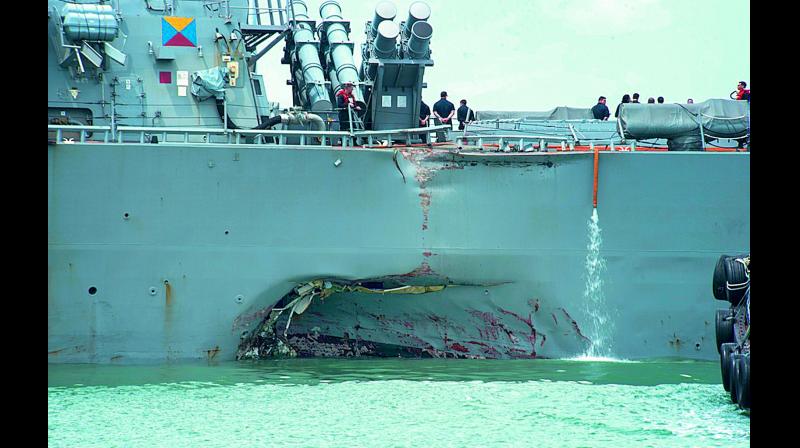 The collision caused major damage to the port side of the USS John S. McCain (AFP)