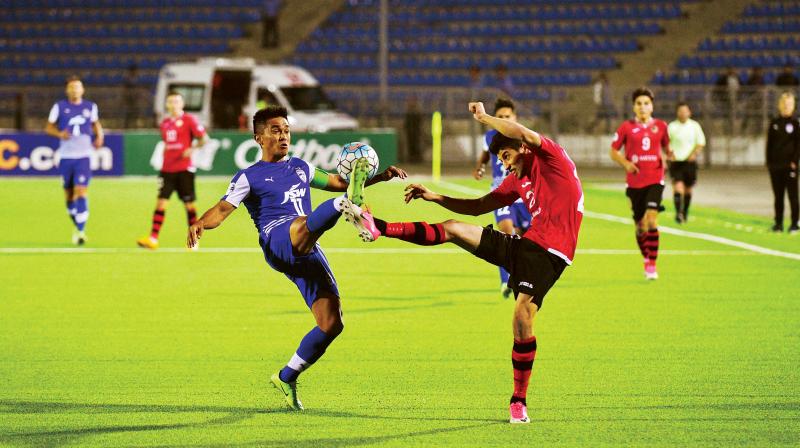 Sunil Chettri vies for the ball against an FC Istiklol defender on Wednesday (Photo: DC)
