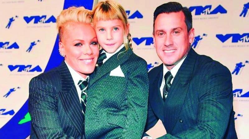 At the MTV VMAs, singer Pink, her husband and their daughter Willow wore matching three-piece suits