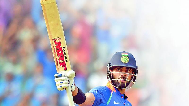 Virat Kohli celebrates his century during the first ODI against New Zealand in Mumbai.(Photo: AP)