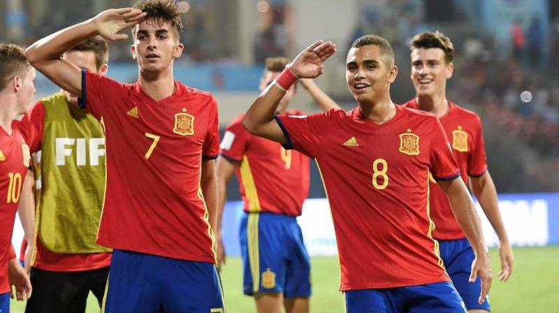 Spain player Ferran Torres (Red Jersey no. 7) and Mohamed Moukhliss (Yellow Jersey no. 8) celebrate after striking a goal against Mali during the FIFA U-17 World Cup Semi final match at D Y Patil Stadium in Mumbai. (Photo: AP)