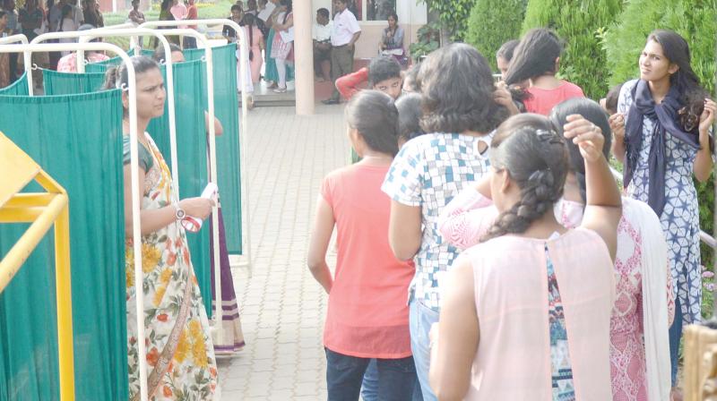  Female candidates undergoing security check at an NEET centre in Bengaluru on Sunday  -DC 