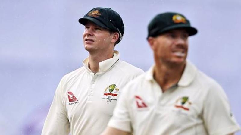 Steve Smith and David Warner may wake with some relief on Thursday as they greet the final day of their ball-tampering bans but the anniversary of their humiliation will otherwise be a sombre milestone for Australias cricket fans. (Photo: AP)