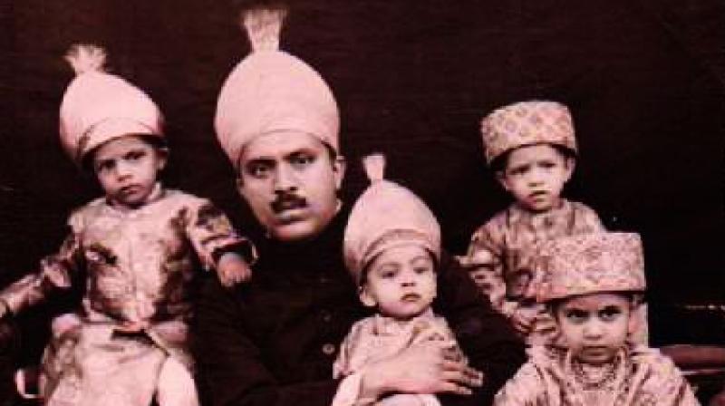 Prince Hasham Jah Bahadur along with his children.