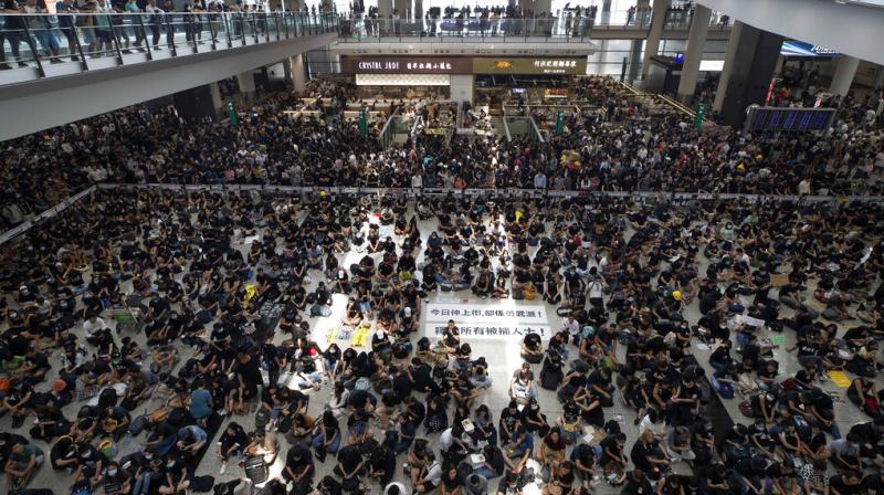 Hong Kong airport stops flights today as protesters storm arrivals halls