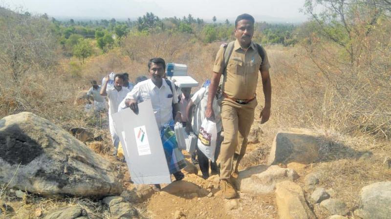 Poll officials walk 15 km with EVMs fearing Maoist attack