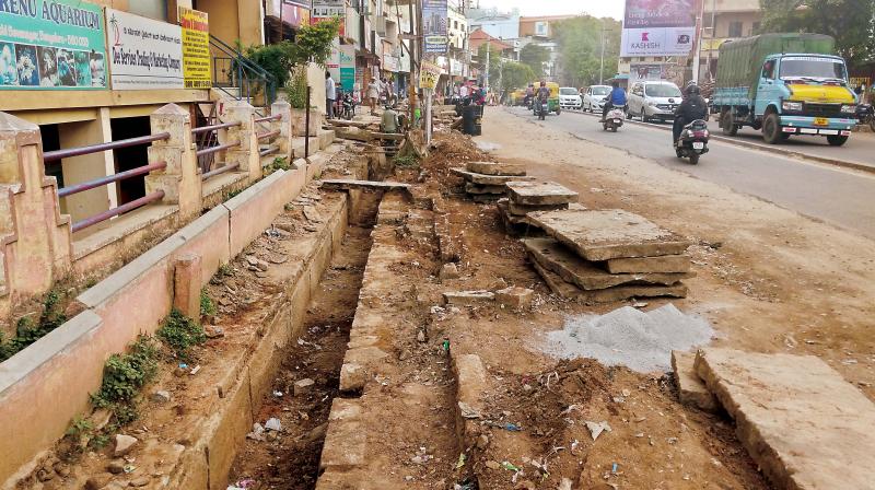 The dust from the unsurfaced portion chokes residents, shop owners and commuters. But when the road will be resurfaced and made usable remains unclear.
