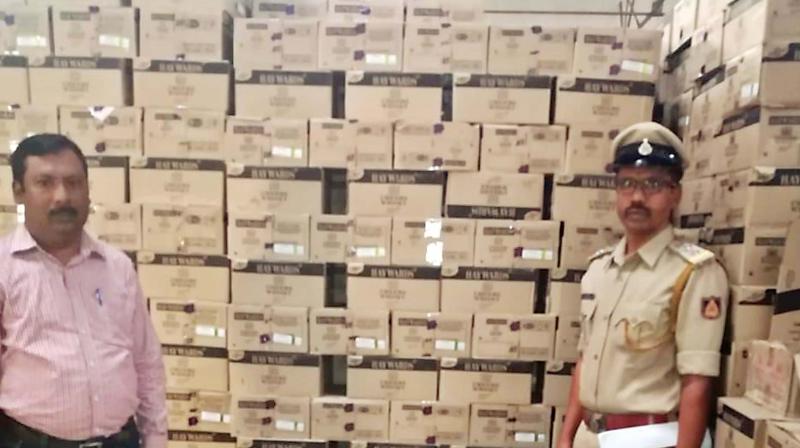 Liquor cache seized in Shivamogga