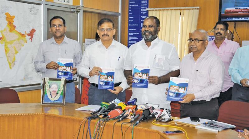 State Revenue minister R. B. Udayakumar launching the manual on disaster management ahead of the Northeast Monsoon, in the city on Sunday. Senior  officials are also seen.  (DC)