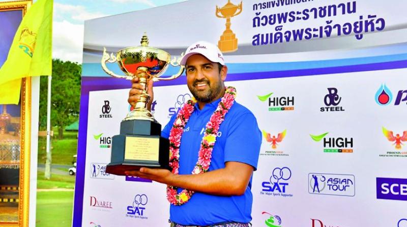 Shiv Kapur poses with the trophy after winning the Royal Cup in Pattaya, Thailand, on Sunday. It was Shivs third Asian Tour title of the year.