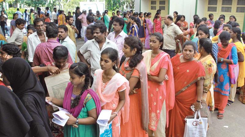 Parents and aspiring candidates stand in long queues to get admission forms in  Dr M.G.R. Janaki Arts & Science College. (Photo: DC)