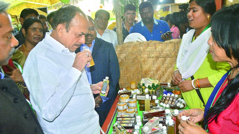 Home minister Mohammad Mahmood Ali checks out the organic products at the Women of India Organic Food Festival at Shilpramam on Wednesday. (Image DC)