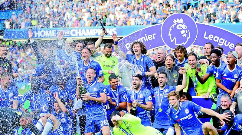 The Chelsea team including captain John Terry, 26, celebrate after they won the league, following the English Premier League soccer match between Chelsea and Sunderland at Stamford Bridge stadium in London, Sunday (Photo: AP)