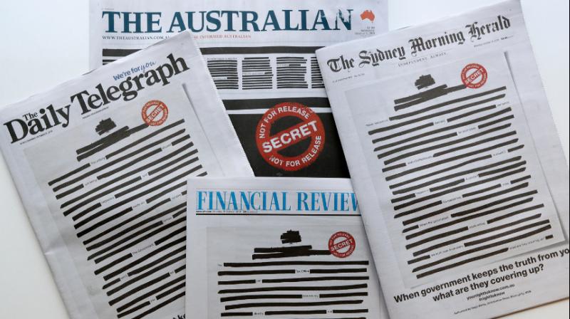 Australian papers black out front pages in protest against media restrictions