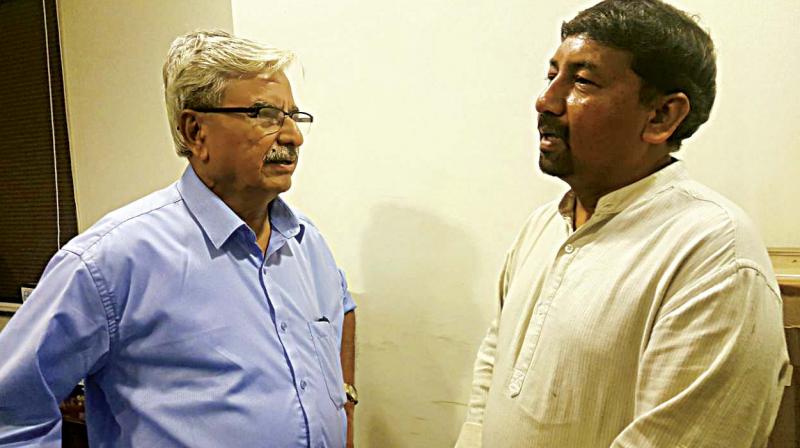 B.S. Anantharam (left) and Mohan Raju feel the city transport authorities should learn from the recent Mumbai stampede to prevent such tragedies in Bengaluru. (Photo: DC)