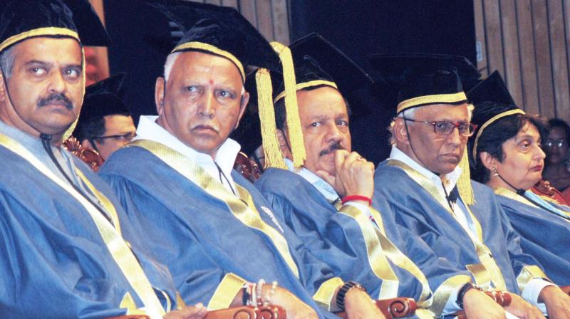 Chief Minister B.S. Yediyurappa (from L), Union Minister for Health and Family Welfare Dr Harsh Vardhan and Director NIMHANS Dr B.N. Gangadhar at the 24th Convocation of National Institute of Mental Health and Neuro Sciences at NIMHANS convention centre in Bengaluru on Monday (Photo: KPN)