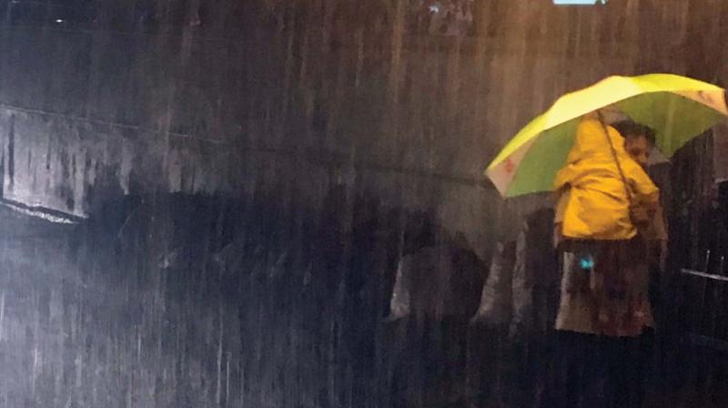 Heavy rains lashed Bengaluru late on Monday evening, flooding several areas and throwing traffic out of gear (Photo: KPN)
