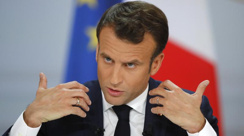Emmanuel Macron offers additional tax cuts to calm \yellow vests\ protests