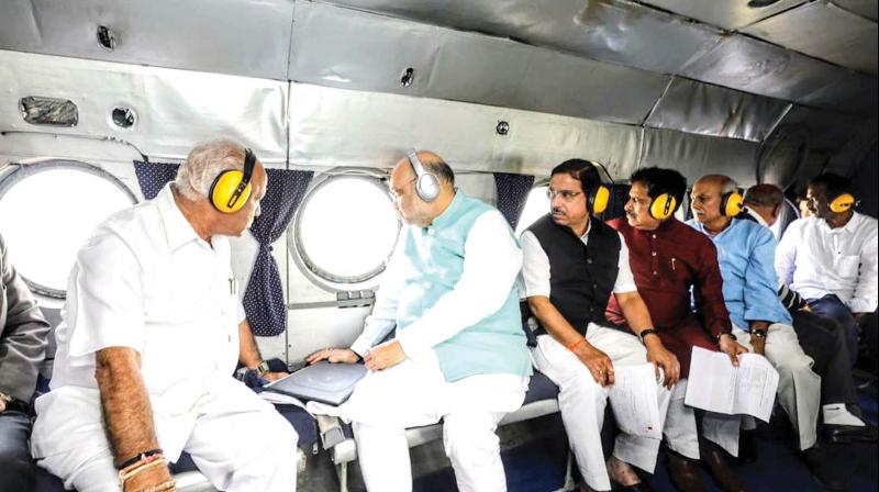 Union Home Minister Amit Shah conducts an aerial survey of flood-hit areas of Belagavi on Sunday (Photo: KPN)