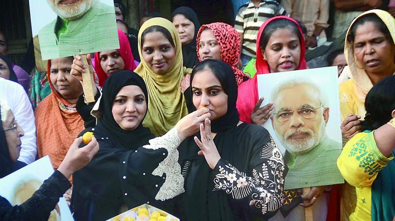 Muslim women celebrate the apex courts verdict on triple talaq. (Photo: PTI)