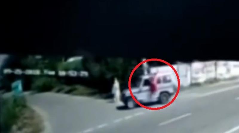A village CCTV footage purportedly showed the woman lying on top of the vehicle and then falling off when it took a sharp turn. (YouTube Screengrab)