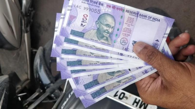The Indian rupee nosedived to a new life-time low of 71.10, shedding 10 paise against the US dollar in late afternoon trade on Monday, tracking weakening trend in emerging market currencies. (Photo: DC)