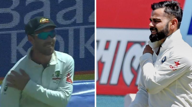 Glenn Maxwell was seen mocking Virat Kohlis injury when he replicated the Indian skippers action by clutching his right shoulder after his dive to save a boundary in the 80.3 overs on Saturday. (Photo: Screengrab / PTI)