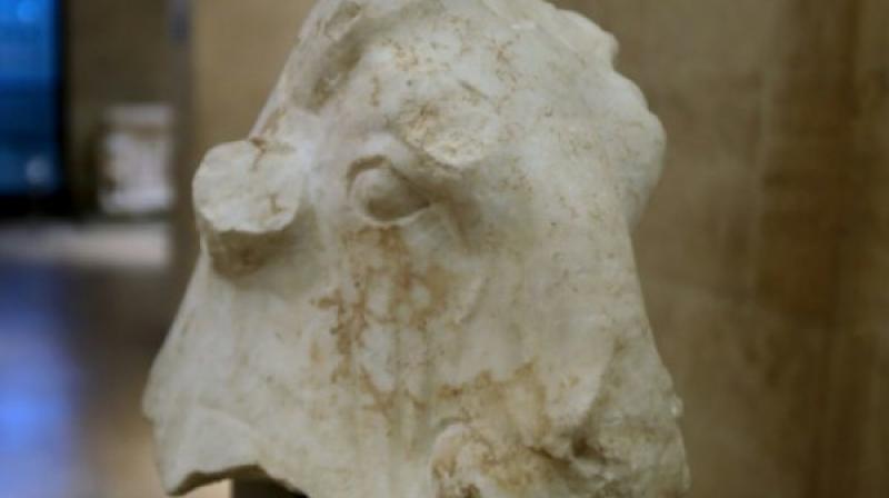 The life-size 4th century BC white marble bulls head, the star artefact among the works that were all looted in 1981. (Photo: AFP)