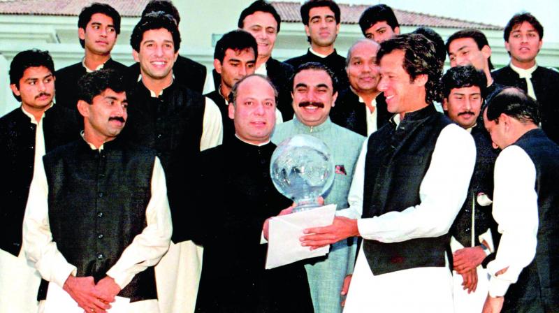 A file photo of Imran Khan offering the World Cup to the then Prime Minister of Pakistan Nawaz Sharif during a dinner hosted in honor of the team after they clinched the 1992 World Cup. (Photo:  AP)