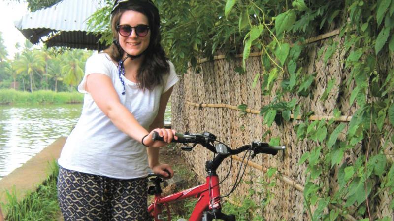 Tara Jowers, a visitor from United Kingdom, during her cycling tour to Kuttanad.  (Photo:  DC)