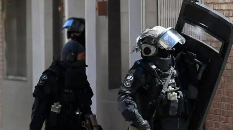Special police forces leave after searching the apartment of a man who tried to attack a police station in Cornella near the northeastern Spanish city of Barcelona on August 20, 2018. (Photo: AFP)