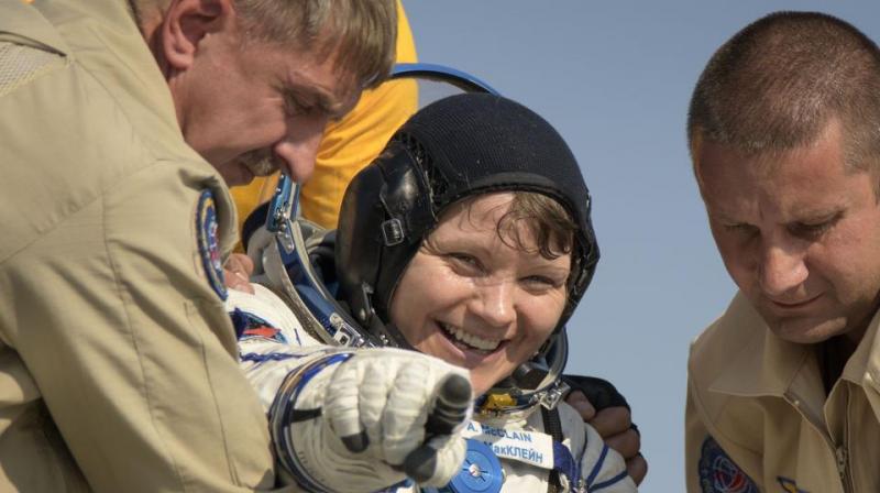 NASA astronauts, space station crew mates return to Earth after 204 days