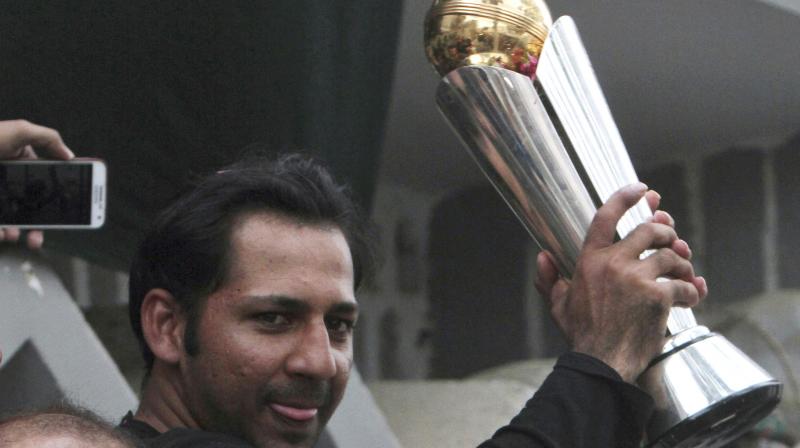 Sarfraz Ahmed held up the trophy to loud cheers and chants of \Long live Sarfraz!\ as a police band played patriotic songs nearby.(Photo: AP)