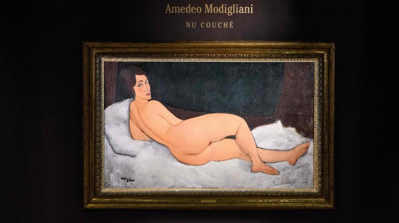 Italian painter and sculptor Amedeo Clemente Modiglianis Nu couchÃ© (sur le cÃ´tÃ© gauche) painting is displayed after its unveiling at the Sothebys auction house showroom in Hong Kong on April 24, 2018.(Photo: AFP)