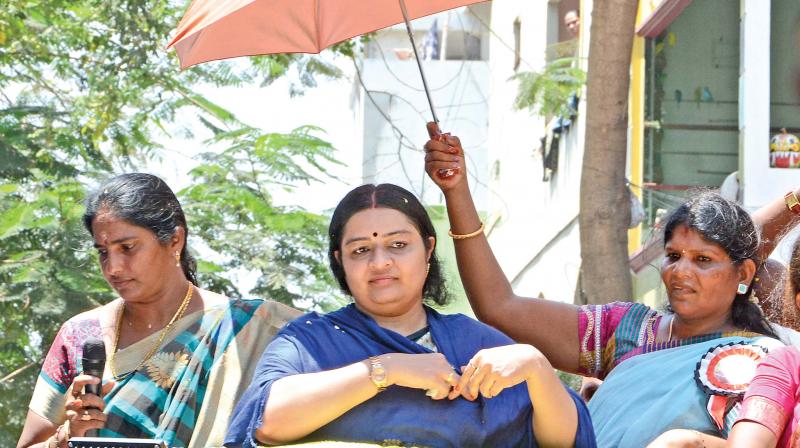 MGR Amma Deepa Peravai leader Deepa campaigns at RK Nagar with an umbrella on Thursday (Photo: DC)