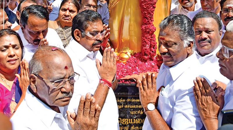 Chief Minister Edappadi K. Palaniswami and Deputy Chief Minister O. Panneerselvam pay tribute after unveiling of a statue of former Tamil Nadu Chief Minister late J. Jayalalithaa at party headquarters on the occasion of her 70th birth anniversary in Chennai on Saturday. 	 DC