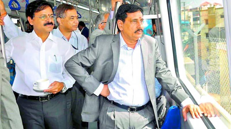 MD and CEO of L&TMRHL K.V.B. Reddy was seen consuming beverage inside Metro coach during a trail run from Hitec City on Thursday in the presence of HMRL MD N.V.S. Reddy. As per Metro rules smoking, consuming drinks and eating snacks cannot be done inside Metro coach. (Photo: S. Surender Reddy)
