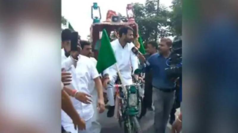Tej Pratap Yadav had driven the cycle rickshaw for some distance before stating everybody should drive a rickshaw. It would come in handy at a time when fuel prices are soaring. The physical exertion involved would also bring health benefits. (Photo: Twitter | @TejPratap14)