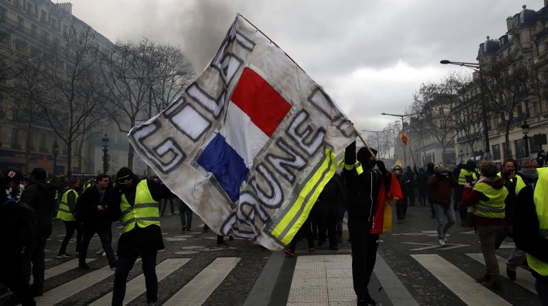 Unrest in Paris continue as yellow vests loot, burn luxury stores