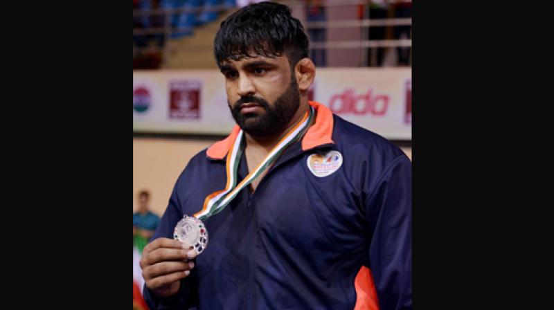 Silver medalist Indias wrestler Sumit after 125 kg category event at Asian Wrestling Championship at I G Stadium in New Delhi on Saturday (Photo: AP)