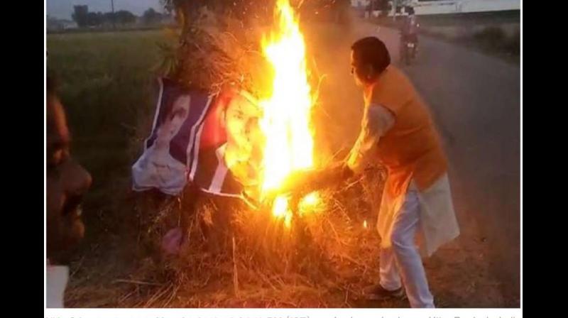 BJP leaders burn Mayawati, Akhilesh posters during \Holika Dahan\, FIR filed