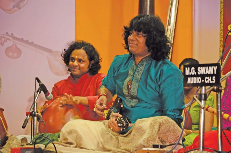      <<<< Mandolin  U. Rajesh  performing  at Parthasarathy Swami Sabha music festival on Wednesday. 	DC  