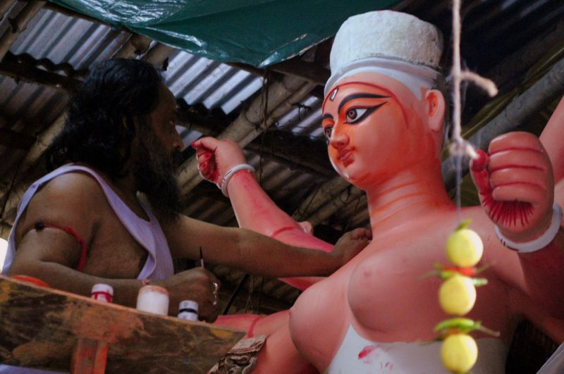 An artist paints the eyes of the Goddess on Mahalaya (Photo: Soumyabrata Gupta)