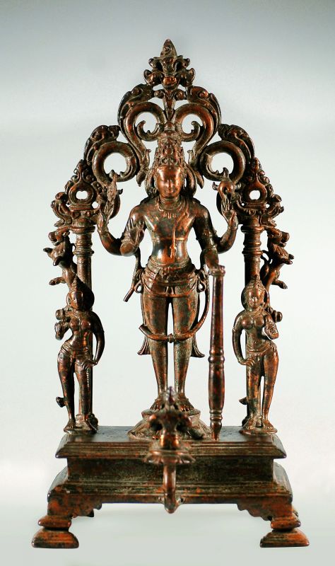 A later Western Chalukyan style bronze statue of Lord Vishnu, flanked by goddesses Sridevi and Bhudevi, dated 10th Century.