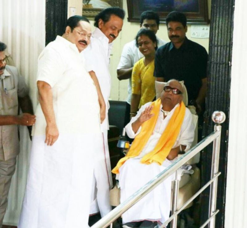 The wheelchair-bound Karunanidhi made a brief appearance outside and waved at his supporters who cheered him. (Photo: Twitter @kalaignar89