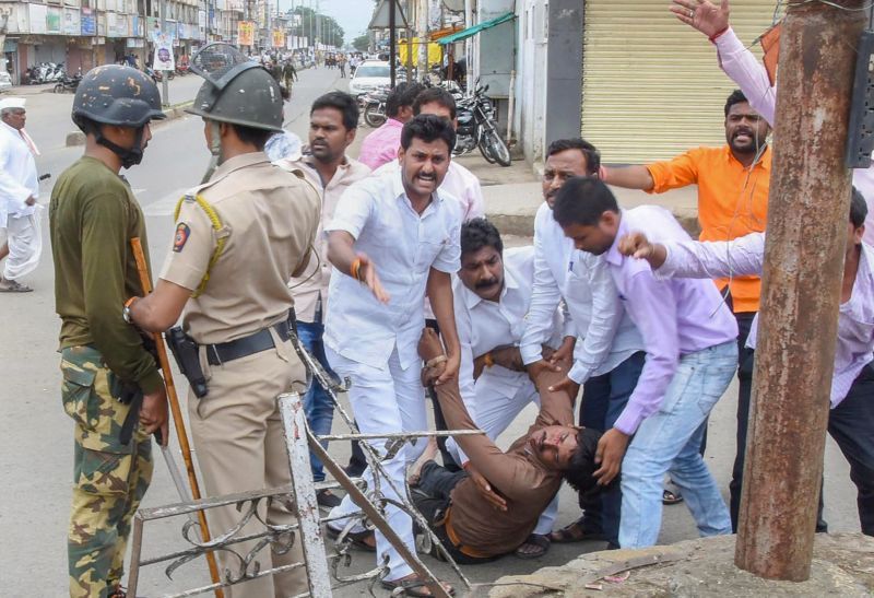 A protester is carried away after being injured during a protest rally demanding reservation for Marathis, in Nanded on Tuesday. (Photo: PTI)