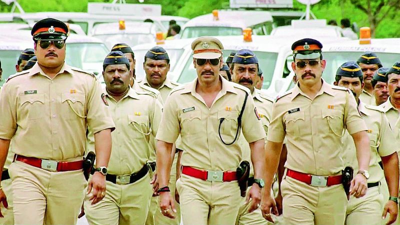 A still from the movie Singham where Ajay Devgn is a cop who fights the bad guys.